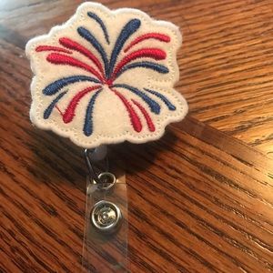 Firework badge reel